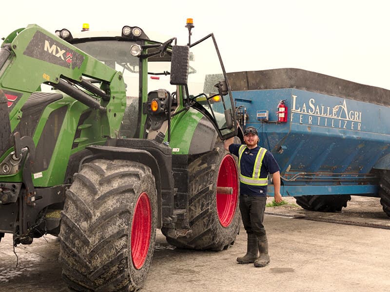 DaBuurma Farms tractor with spreader in the field